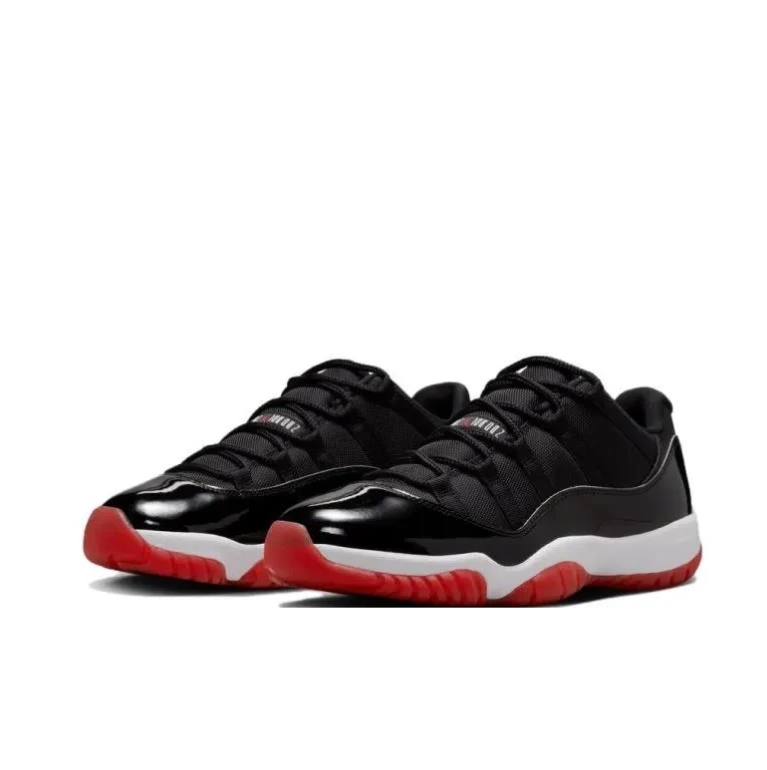 Air Jordan Black Low-Top Sneakers with Glossy Panels & Red Outsoles