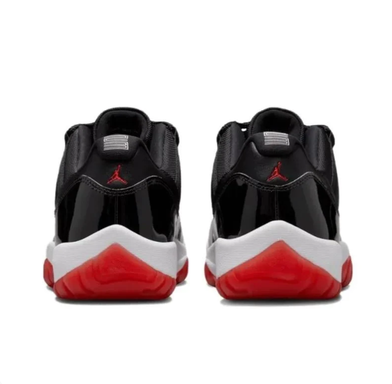 Air Jordan Black Low-Top Sneakers with Glossy Panels & Red Outsoles